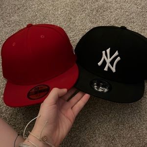one fitted red regular cap, one snapback yankees black cap.